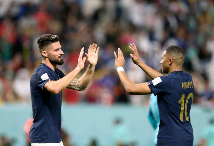 Olivier Giroud (left) and Kylian Mbappe pictured high-fiving during France's 4-1 win over Australia at the 2022 World Cup
